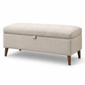 Panca contenitore in tessuto beige con gambe in legno